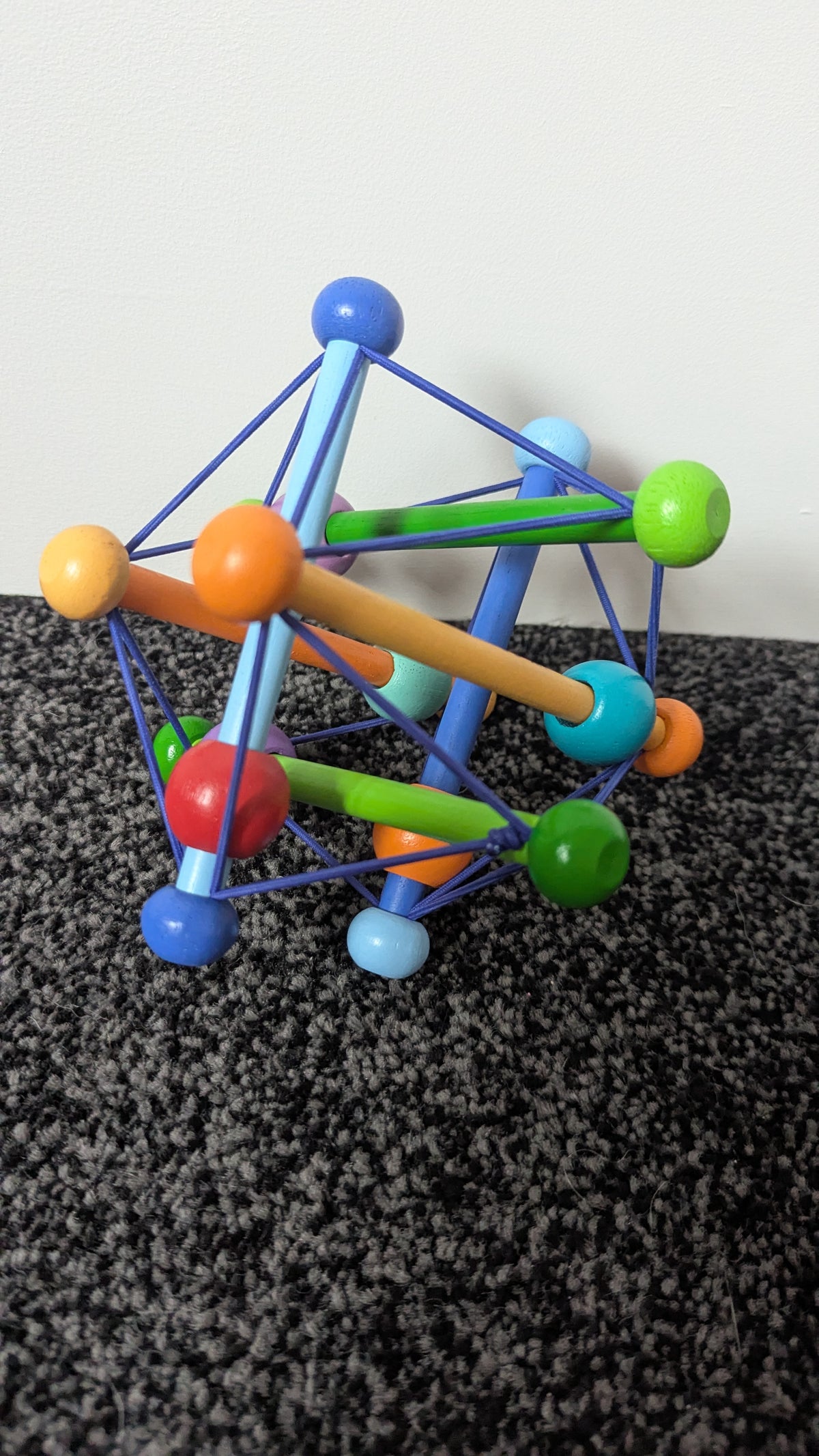Skwish Colour Burst Wooden Rattle & Grasping Activity Toy