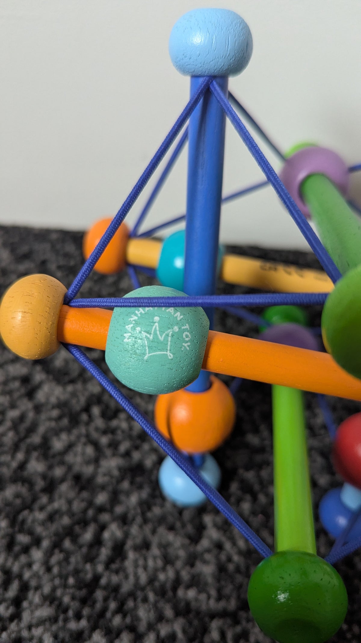 Skwish Colour Burst Wooden Rattle & Grasping Activity Toy